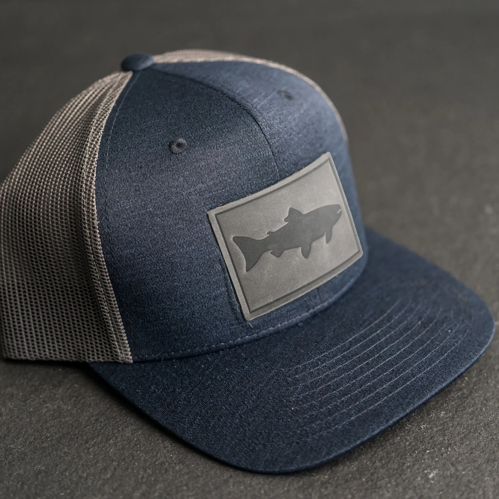 Leather Patch Performance Style Trucker Hat - Fish Stamp