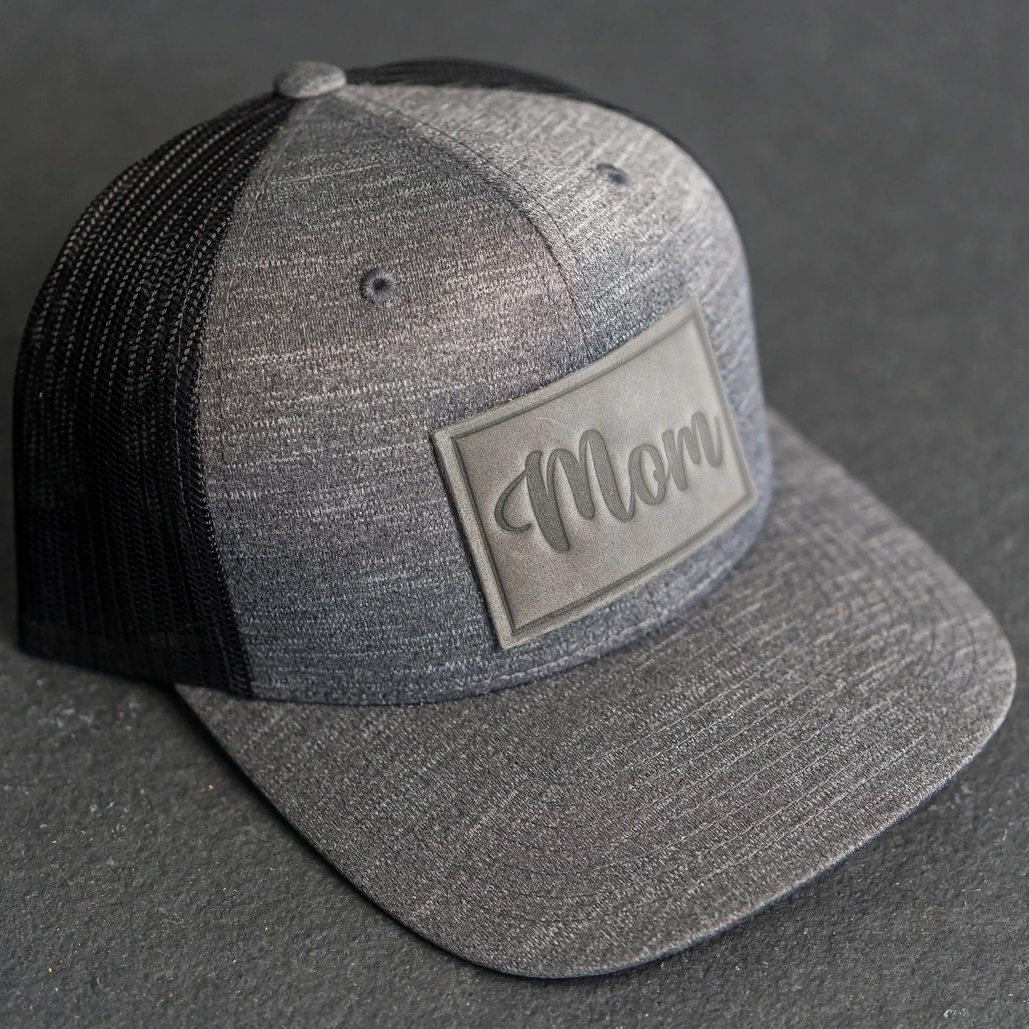 Leather Patch Performance Style Trucker Hat - Mom Cursive Stamp