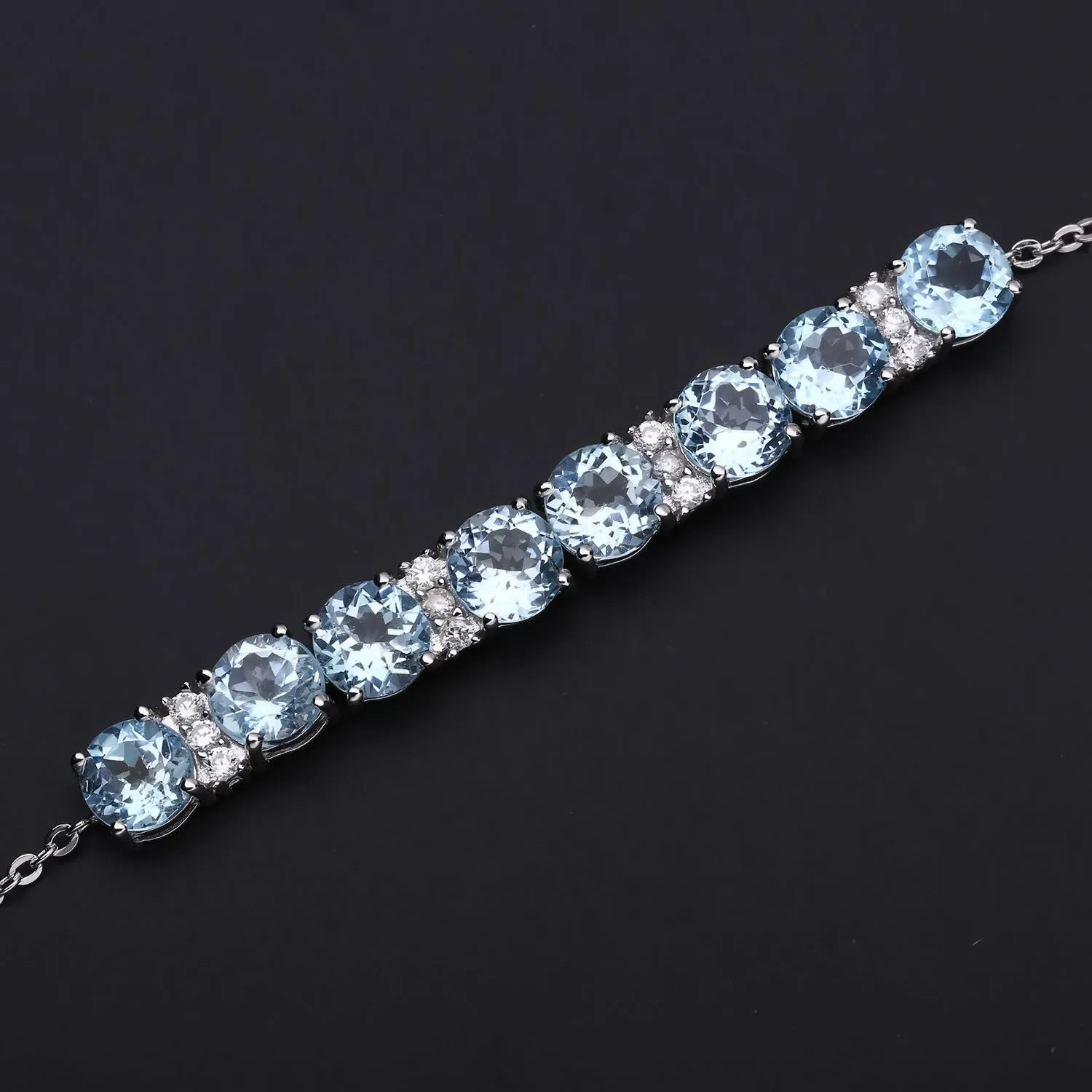 Row of Round Cut Natural Blue Topaz Silver Bracelet